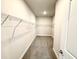 Walk-in closet with metal shelving and gray carpet at 328 Bishop Lane, Sanford, NC 27330