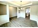 Formal dining area showcasing open access to the kitchen, with stylish pendant lighting at 328 Bishop Lane, Sanford, NC 27330