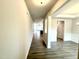 Inviting hallway with luxury vinyl plank flooring leading to open-concept living spaces at 328 Bishop Lane, Sanford, NC 27330