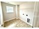Bright laundry room with tile floors and modern connections at 328 Bishop Lane, Sanford, NC 27330