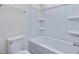 Clean bathroom with a bathtub, shower, and built-in shelving at 40 Lavender Ln, Clayton, NC 27520