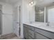 Double vanity bathroom with a large mirror and shower at 40 Lavender Ln, Clayton, NC 27520