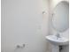 Simple bathroom with pedestal sink and oval mirror at 40 Lavender Ln, Clayton, NC 27520
