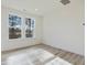 Bright bedroom with hardwood floors and large windows at 40 Lavender Ln, Clayton, NC 27520