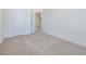 Spacious bedroom with neutral walls and carpet, offering access to a hallway at 40 Lavender Ln, Clayton, NC 27520
