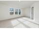 Spacious bedroom with neutral carpeting and door to hallway at 40 Lavender Ln, Clayton, NC 27520