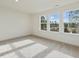 Spacious bedroom with neutral carpeting and multiple windows at 40 Lavender Ln, Clayton, NC 27520