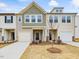 Two-story townhome with neutral siding and landscaping at 40 Lavender Ln, Clayton, NC 27520
