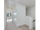 Upstairs hallway with carpet, linen closet and bedroom access at 40 Lavender Ln, Clayton, NC 27520