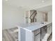 Modern kitchen with gray island, stainless steel appliances and quartz countertops at 40 Lavender Ln, Clayton, NC 27520