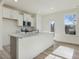 Modern kitchen featuring white cabinets, stainless steel appliances, and an island at 40 Lavender Ln, Clayton, NC 27520