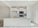 Modern kitchen with white cabinets, stainless steel appliances and quartz countertops at 40 Lavender Ln, Clayton, NC 27520