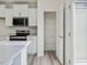 Modern kitchen with white cabinets, a walk-in pantry and stainless steel appliances at 40 Lavender Ln, Clayton, NC 27520