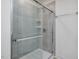 Clean shower with gray tile and glass enclosure at 40 Lavender Ln, Clayton, NC 27520