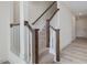 Stairway with simple wood railing and neutral carpeting at 40 Lavender Ln, Clayton, NC 27520