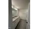 Bathroom features dual sinks with granite counters, white cabinetry, and tile floors at 52 Quail Point Cir, Clayton, NC 27520