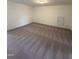 Spacious bonus room featuring plush carpet and neutral walls at 52 Quail Point Cir, Clayton, NC 27520