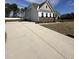 Charming two-story home with a long driveway and a spacious front yard at 52 Quail Point Cir, Clayton, NC 27520