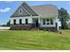 Charming two-story home with brick accents and a well-manicured lawn in a peaceful, friendly neighborhood at 52 Quail Point Cir, Clayton, NC 27520