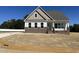 Two-story home with brick accents and a spacious front yard at 52 Quail Point Cir, Clayton, NC 27520