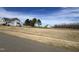 A charming two-story home features white siding, complementing the expansive yard and neighborhood homes at 52 Quail Point Cir, Clayton, NC 27520