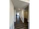 Hallway with decorative trim and access to storage at 52 Quail Point Cir, Clayton, NC 27520