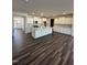 Spacious kitchen with white cabinets, large island, and dark wood floors at 52 Quail Point Cir, Clayton, NC 27520