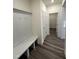 Mud room with built-in storage and coat hooks, leading to a pantry at 52 Quail Point Cir, Clayton, NC 27520