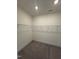 Walk-in closet with wire shelving and carpeted floors at 52 Quail Point Cir, Clayton, NC 27520
