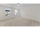 Spacious bedroom with carpet and two windows at 1019 Gibson House Dr, Burlington, NC 27215