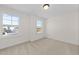 Bedroom with carpet, neutral walls, and two windows at 1019 Gibson House Dr, Burlington, NC 27215