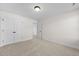 Bedroom with carpet, double doors to closet, and access to another room at 1019 Gibson House Dr, Burlington, NC 27215