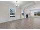 Spacious dining room with hardwood floors, fireplace and large windows at 1019 Gibson House Dr, Burlington, NC 27215