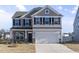 Two-story house with gray siding, white trim, and a two-car garage at 1019 Gibson House Dr, Burlington, NC 27215