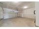 Unfinished two-car garage with automatic opener at 1019 Gibson House Dr, Burlington, NC 27215