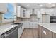 Modern kitchen with farmhouse sink, stainless steel appliances, and stylish backsplash at 1019 Gibson House Dr, Burlington, NC 27215