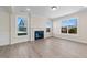 Spacious living room with hardwood floors, fireplace and large windows at 1019 Gibson House Dr, Burlington, NC 27215