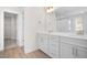 Double vanity bathroom with white cabinets and a walk-in shower at 1078 Gibson House Dr, Burlington, NC 27215