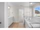 Bathroom with double vanity, soaking tub and walk-in shower at 1078 Gibson House Dr, Burlington, NC 27215