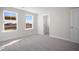 Bedroom with two windows, closet, and carpet at 1078 Gibson House Dr, Burlington, NC 27215