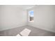 Well-lit bedroom featuring carpet flooring and a window at 1078 Gibson House Dr, Burlington, NC 27215
