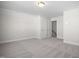 Spacious bedroom with carpet flooring and access to hallway at 1078 Gibson House Dr, Burlington, NC 27215