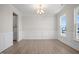 Formal dining room featuring hardwood floors and elegant wainscoting at 1078 Gibson House Dr, Burlington, NC 27215