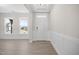 Bright and airy entryway with hardwood floors and wainscoting at 1078 Gibson House Dr, Burlington, NC 27215