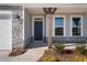Inviting front entrance with a dark-colored door and stone accents at 1078 Gibson House Dr, Burlington, NC 27215