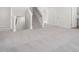 Bright hallway with carpeted floors and staircase at 1078 Gibson House Dr, Burlington, NC 27215