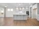Modern kitchen with white cabinets, large island, and stainless steel appliances at 1078 Gibson House Dr, Burlington, NC 27215