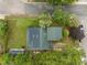 Aerial view showcasing the house, yard, trees, street, and neighborhood from above at 802 N Franklin St, Wake Forest, NC 27587