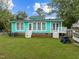 Spacious backyard with lush green grass, two patio decks and ample room for outdoor activities and relaxation at 802 N Franklin St, Wake Forest, NC 27587