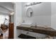 Updated bathroom with modern vanity and open storage offers a sleek, functional space at 802 N Franklin St, Wake Forest, NC 27587